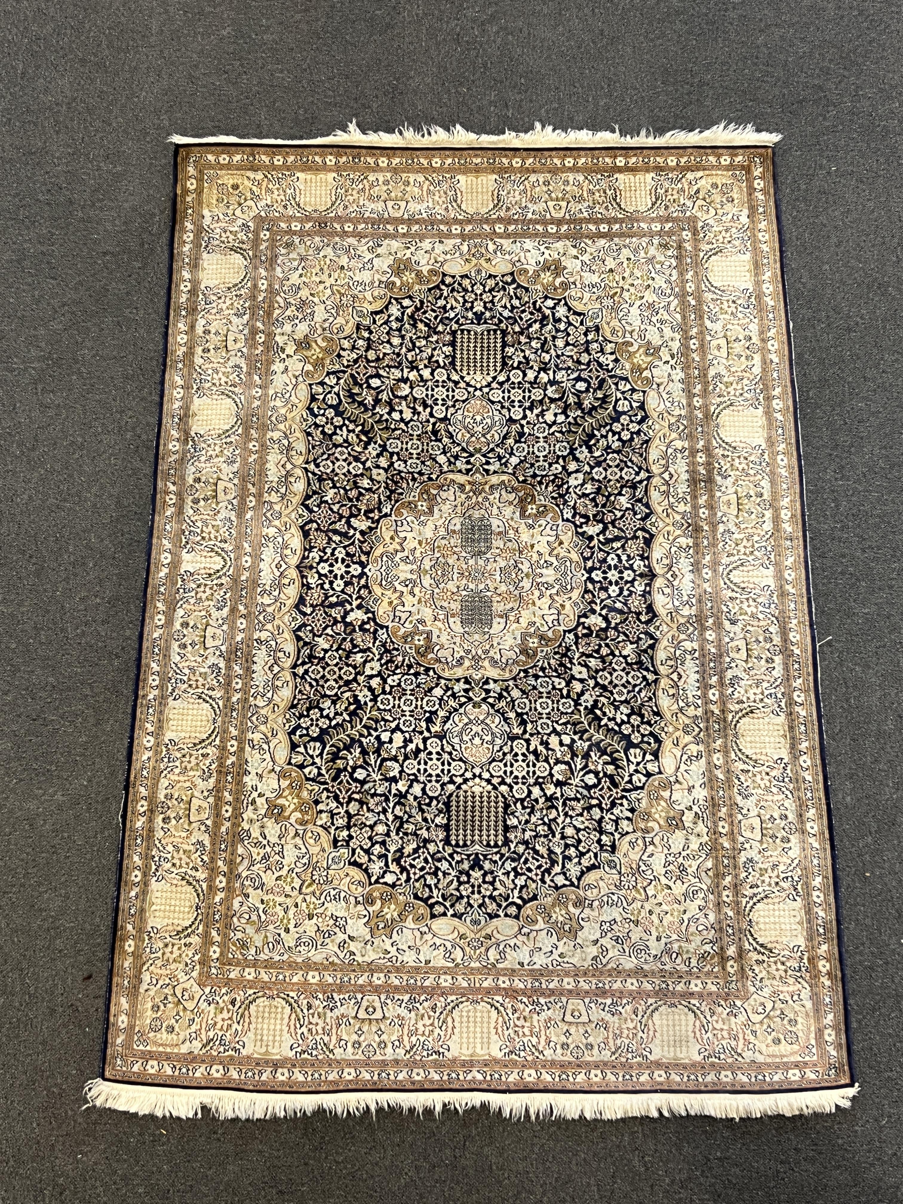 A Persian silk rug, 180 x 120cm